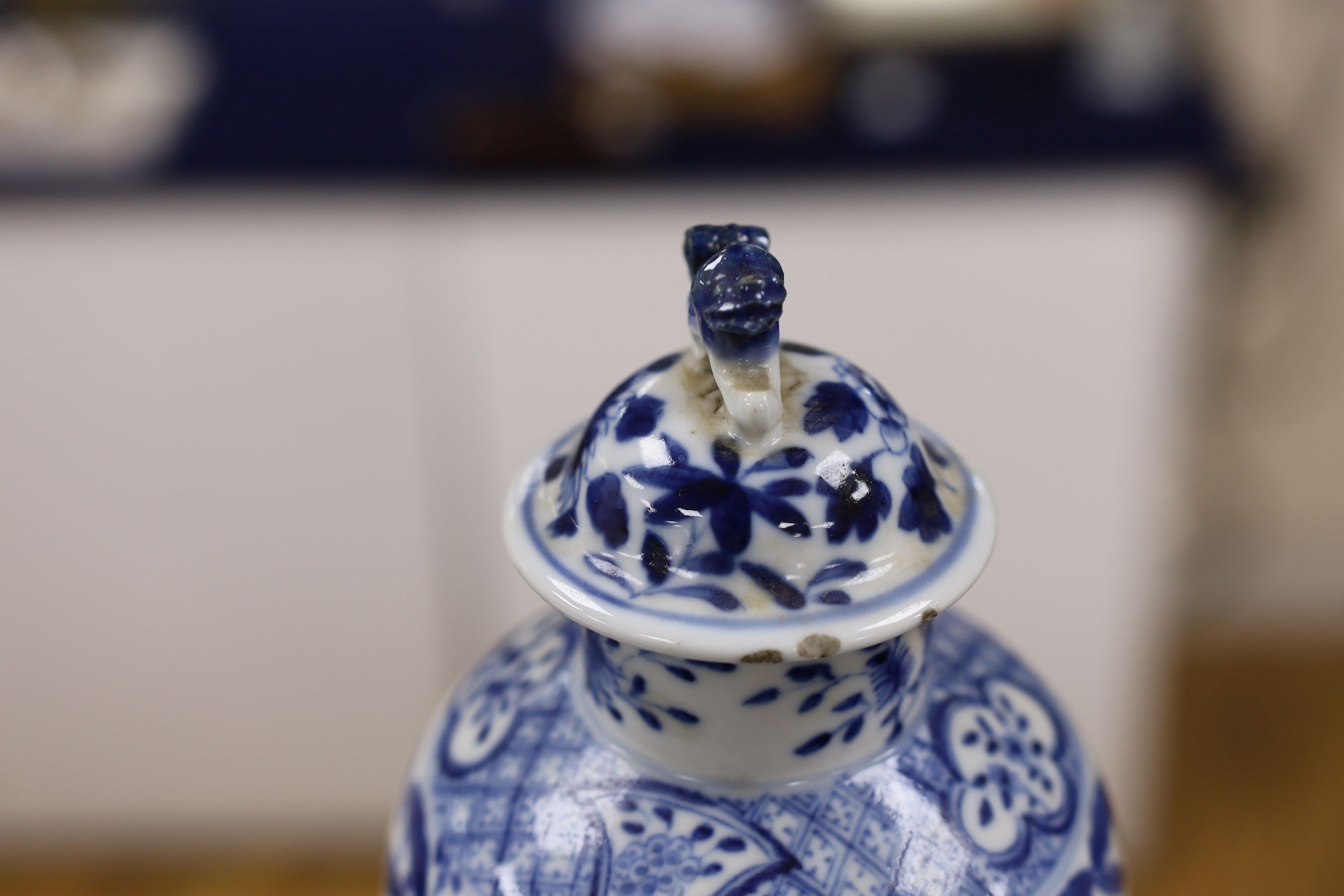 A pair of Chinese blue and white dragon vases and covers, circa 1900. 28cm